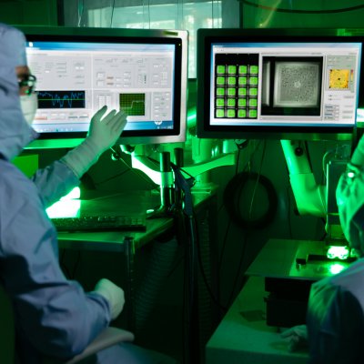 Technicians working with the high-density microarray patch in the Vaxxas cleanroom. Credit: Vaxxas 